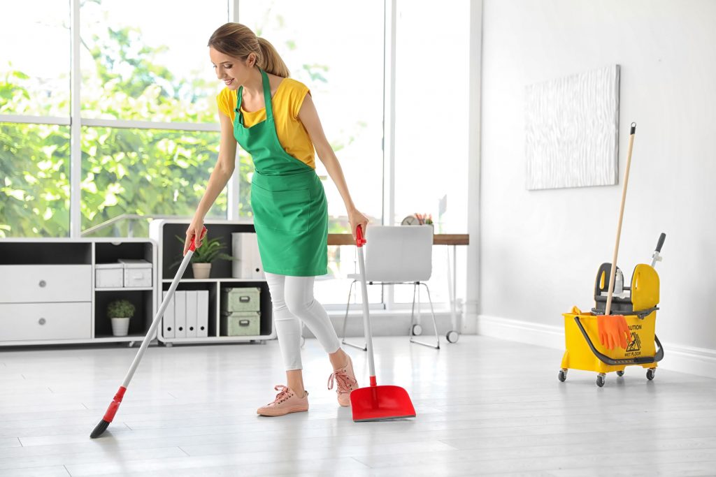 office cleaning services sweeping floor